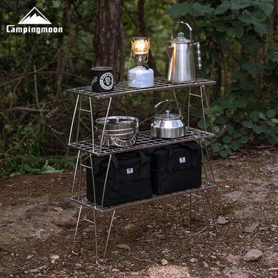 Koman T-225A Tragbarer faltbarer Edelstahl-Gittertisch mit Ablage für Camping und Picknicks.
