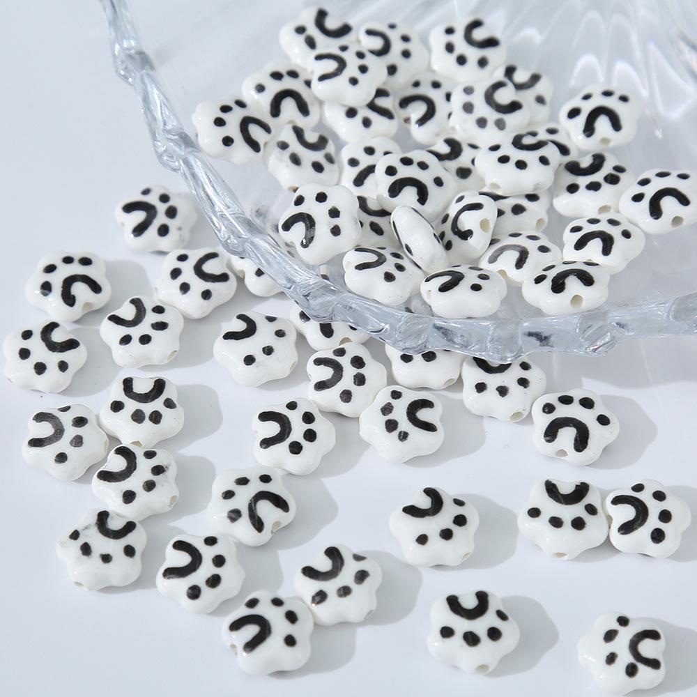 

Черные 3D керамические мультяшные бусины для самодельных украшений ручной работы Cat claw (6×15mm)