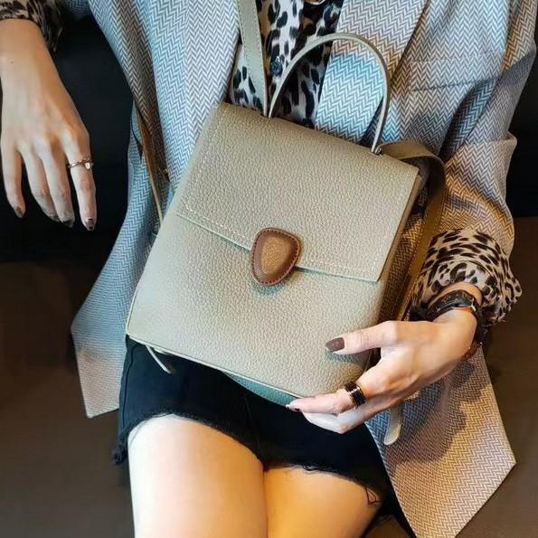 A new type of genuine leather women's bag with a top layer of cowhide and a two-tone color backpack, a simple and casual commuter women's bag