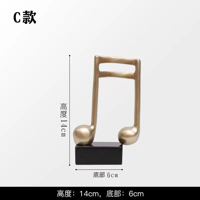 

Resin Sculpture Simple Gold Note Piano Sculpture Ornament Music instruments Dance studio home bookshelf piano room home decor