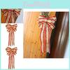Luxurious Gold And Red Christmas Bow Decoration For Celebrating The Holidays