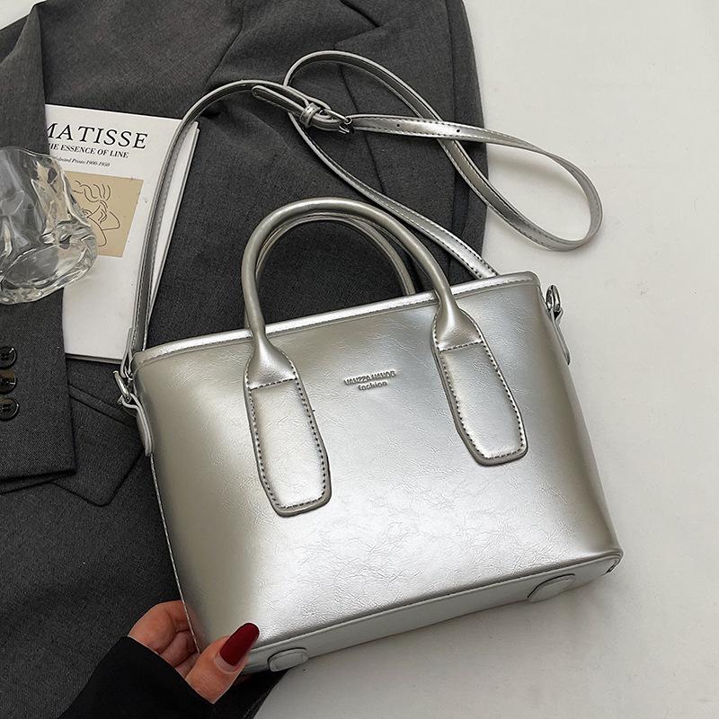 New High-end Korean Version Hugh Simple Portable Bucket Bag Versatile Commuter Fashion Niche Messenger Bag Bag Woman