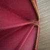 Used PRADA long wallet ribbon round zipper