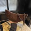 Neue koreanische Nischen-Croissant-Tasche für Damen Sen Meng lässige einfache Umhängetasche Knödeltasche tägliche Pendler-Handytasche