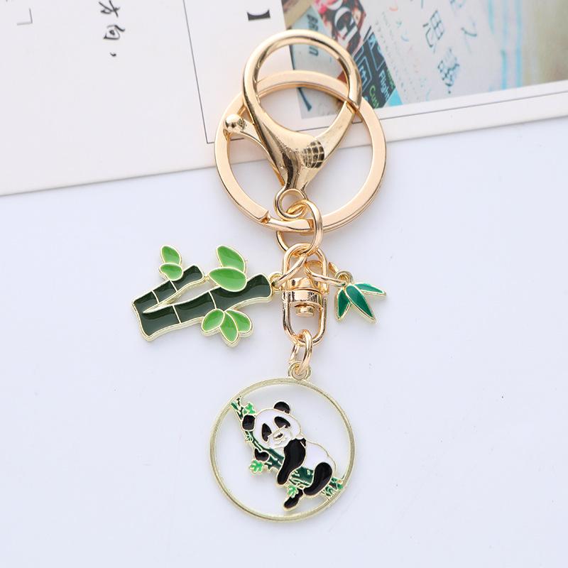 Quirky Cartoon Panda Alloy Keychain Pendant with Cute Bamboo Leaf Design - Earphone Case & Bag Decoration