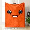 A Smiling Cartoon Face with Wide Eyes and Two Large Teeth On Orange. for All Seasons Blanket Lunch Break Throw Gift