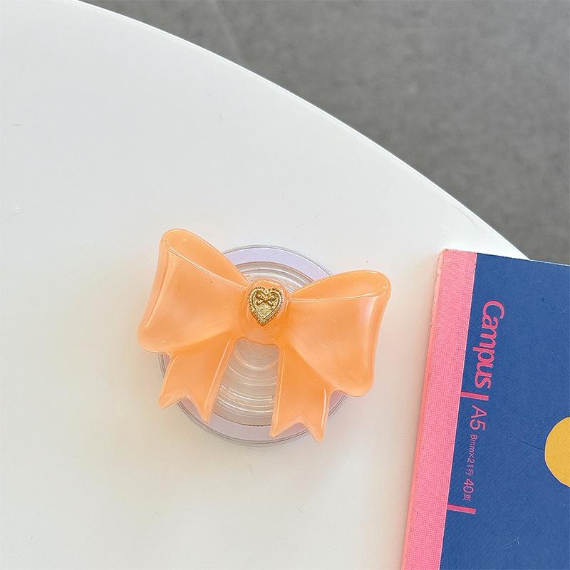 Small Love Three-Dimensional Bow Mobile Phone Airbag Bracket Magnetic Suction Telescopic Folding Desktop Bracket Wind