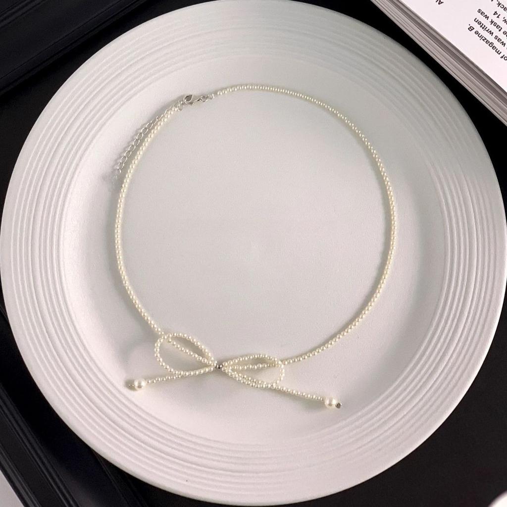 Super fairy bow pearl necklace fashion design collarbone chain colored stone light luxury Internet celebrity accessories neck chain