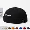 Springnew Arrivalembroiderletter Yuppies Brimless Mel Skin Hat for Men and Women, Same Style Street Hip Hop Style Grids Dome Landlord Hat