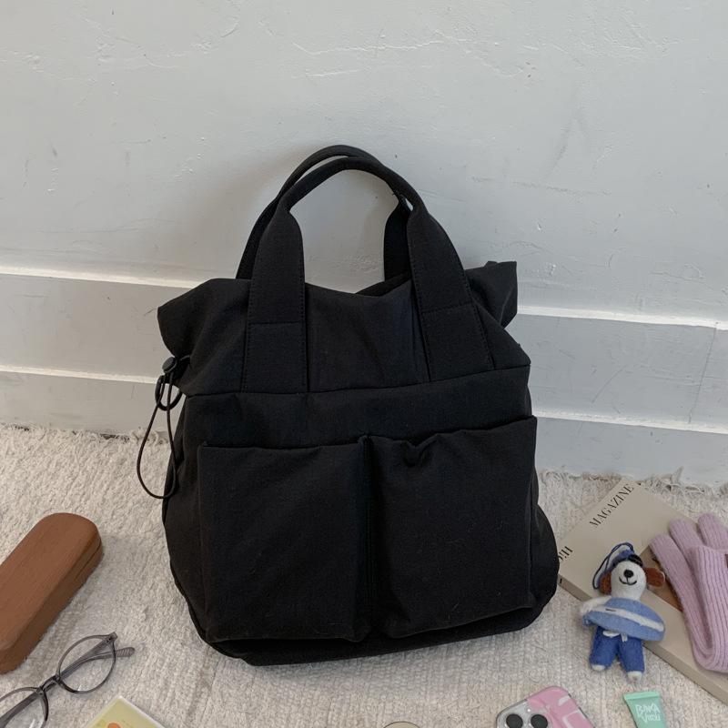 

2025 новая японская однотонная сумка-мессенджер сумка через плечо большая вместимость простая нейтральная сумка-тоут студенческая сумка для занятий чёрный