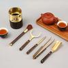 Pure Copper Kung Fu Tea Set: 6-Piece Gentlemen Tea Ceremony Accessories with Wash Cup, Clip, Spoon, Abacus, Pen Holder, and Wooden Elements.