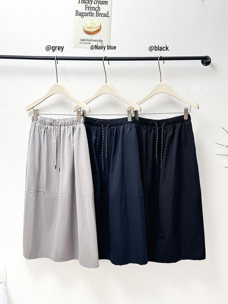 2026 Spring/Summer Retro Cocoon Mid-Length Elastic Waist Skirt - Stylish Solid Color Artistic Bud Design