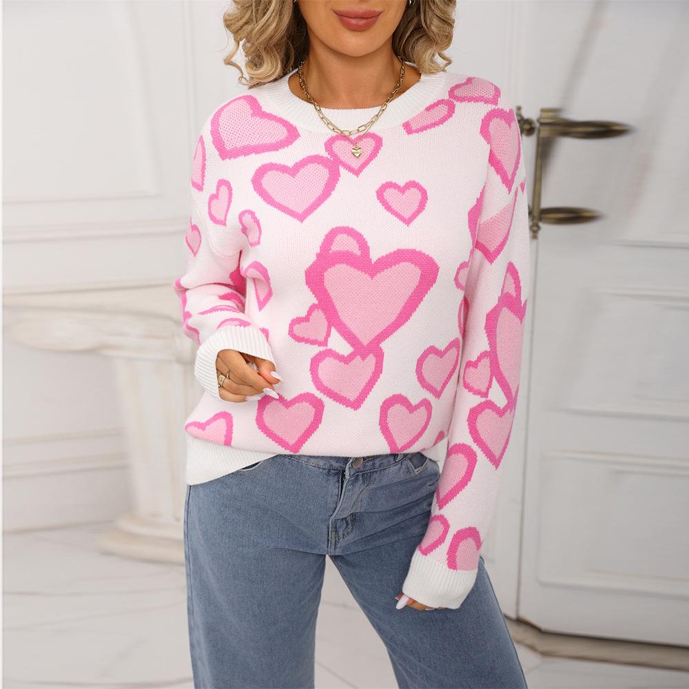 Das neue gestrickte Rundhals-Oberteil für den Herbst ist modisch und vielseitig. Es ist ein Jacquard-Pullover in Herzform mit kleinen Herzen