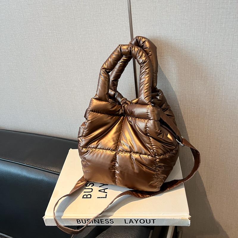 

Autumn new Korean version trendy down bag niche design simple handbag one shoulder crossbody hand carry cotton bag коричневий