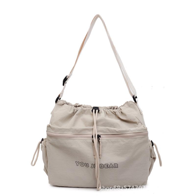 Large-capacity messenger bag women's new light and lazy simple commuter drawstring bundle tote bag casual shoulder bag