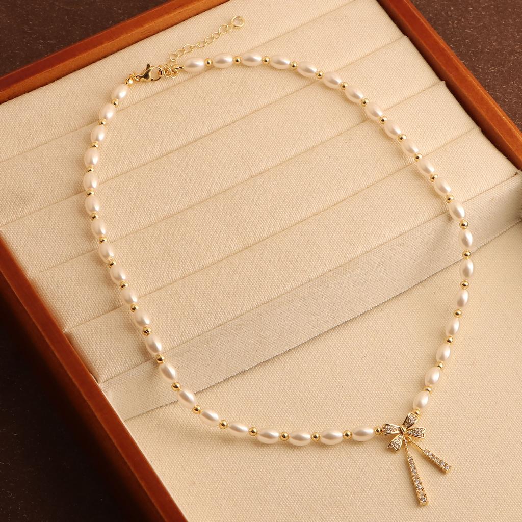 New Freshwater Pearl Necklace Personalized Zircon Bow Necklace French Retro Collarbone Chain Design Sense Necklace Women