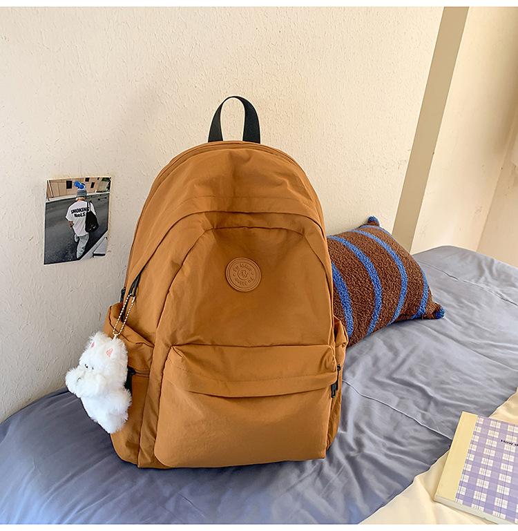 School bag Japanese simple solid color backpack light commuting large capacity student school bag casual versatile outdoor travel backpack