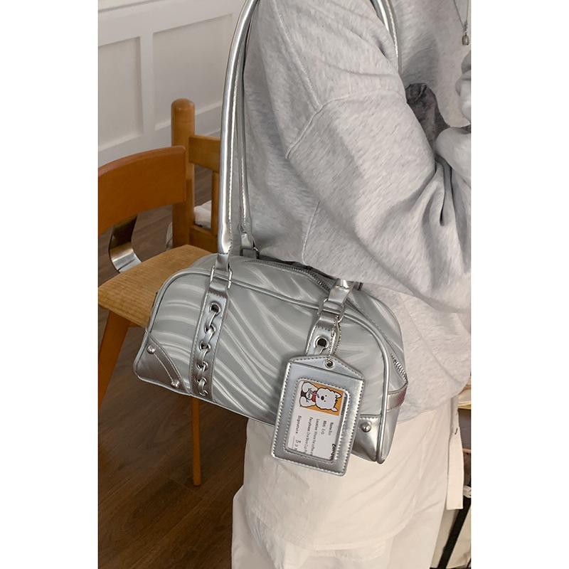 

Niche texture silver underarm bag women s 2025 new fashion portable bowling bag large capacity commuter bag срібний