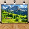 A wall with a tapestry depicting the Swiss Alps - featuring snow-capped mountains lush green grass and farmhouses together