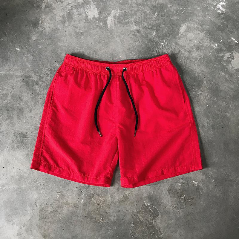 Letnie męskie spodenki casualowe Cukierkowe kolorowe spodnie Five Quarter męskie sportowe luźne szybkoschnące cienkie spodnie plażowe spodenki męskie