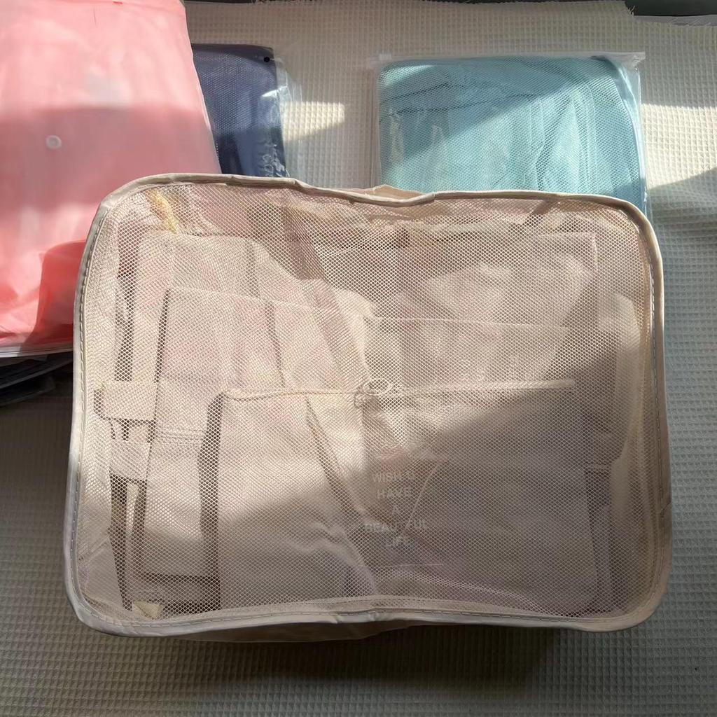 Seven-Piece Travel Packing Bag Set: Clothes, Underwear, Cosmetics, and More.