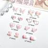 50Pcs Pink Series Bow Heart Resin Nail Charms 3D Luminous Double Butterfly Peach Heart Sweet Wind Nail Art Decorations DIY Nails