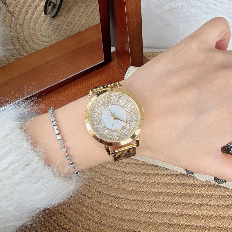 Neuankunft Runde Große Zifferblatt Leopardendruck Uhr Edelstahlarmband Gold High-End Damenuhr Mode Quarz Uhr