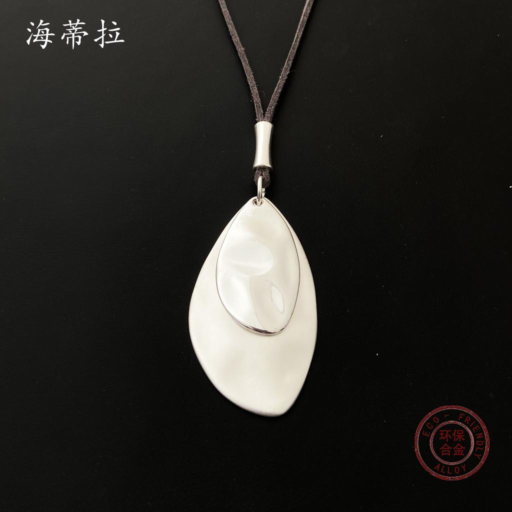 Irregular leaf alloy pendant, simple retro leather rope women's long high-end necklace
