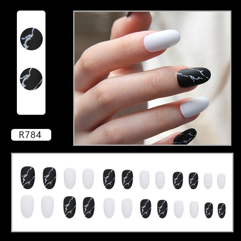 

Simple matte marble pattern manicure, black and white color jumping solid color fake nails, oval round head wearing armor