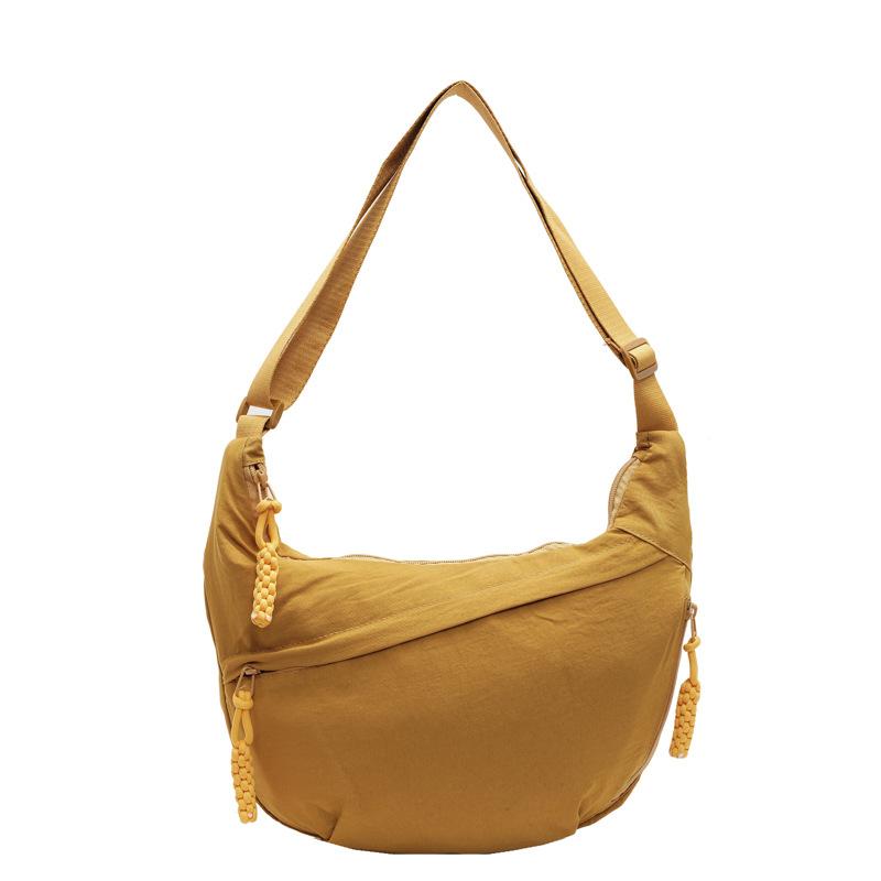 Trendy new products ins simple fashion lightweight sports style dumpling bag leisure travel versatile solid color messenger bag women