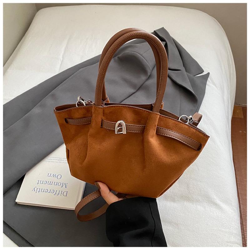

High-value bag women s large-capacity new winter retro niche messenger bag portable commuter bucket bag коричневий