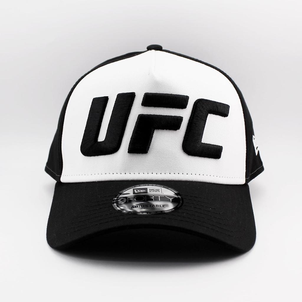 New Era 9FORTY Snapback Cap in collaboration with the Available in white and Adjustable size for men and UFC. black. women. [Used]