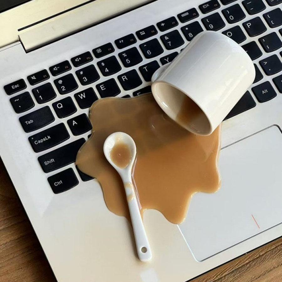 

A spilled coffee spilled a novel and quirky desktop decoration toy, a funny gift, a phone holder коричневый