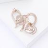 Creative design alloy rhinestone double heart brooch fashionable and versatile women's clothing chest flower accessories