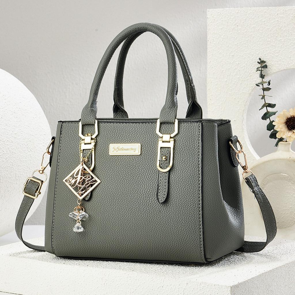 Simple and large-capacity hot-selling handheld women's bags 2026 new fashionable and versatile PU material single shoulder oblique span small