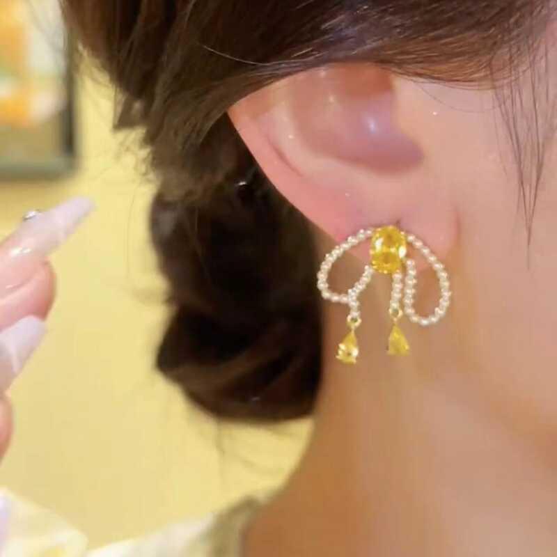Yellow Crystal Bow & Pearl Stud Earrings - Elegant & Versatile