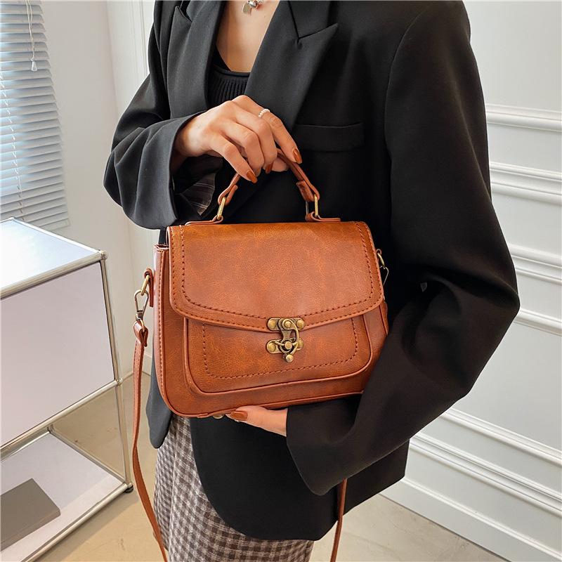 2025 new small square bag retro style portable bag retro lock popular women's bag simple small bag
