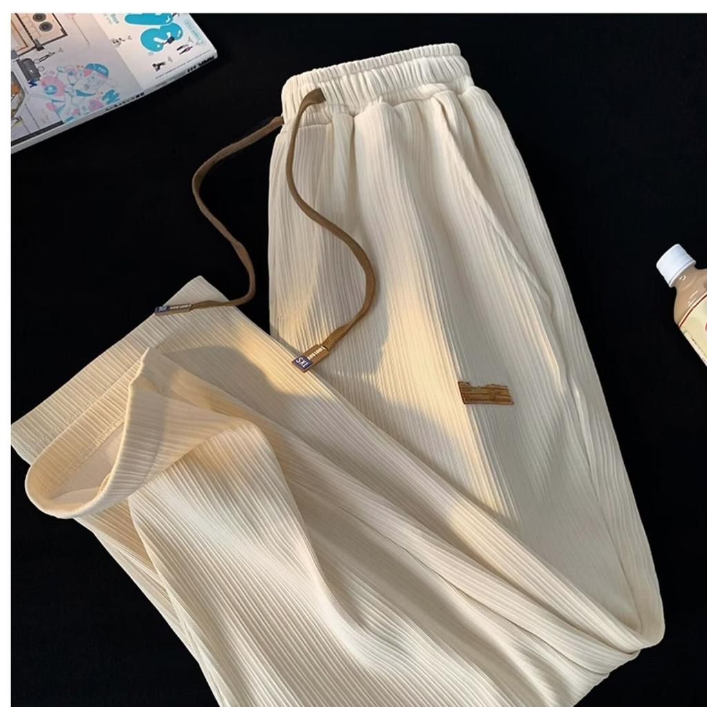 Spodnie codzienne lato nowe spodnie męskie z lodowego jedwabiu cienkie luźne szybkoschnące spodnie z prostą nogawką wersja koreańska wszechstronne modne spodnie dresowe męskie