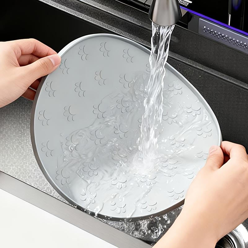 1pc Plastics Pet Feeding Mat |, Leakproof, Non-Slip, Oval Dog and Cat Food Mat for Dogs and Cats,Footprint Texture Feeding Pad