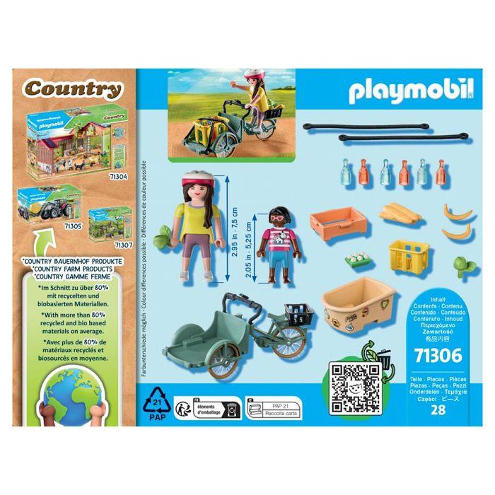 Country - cycliste avec vélo et remorque avant