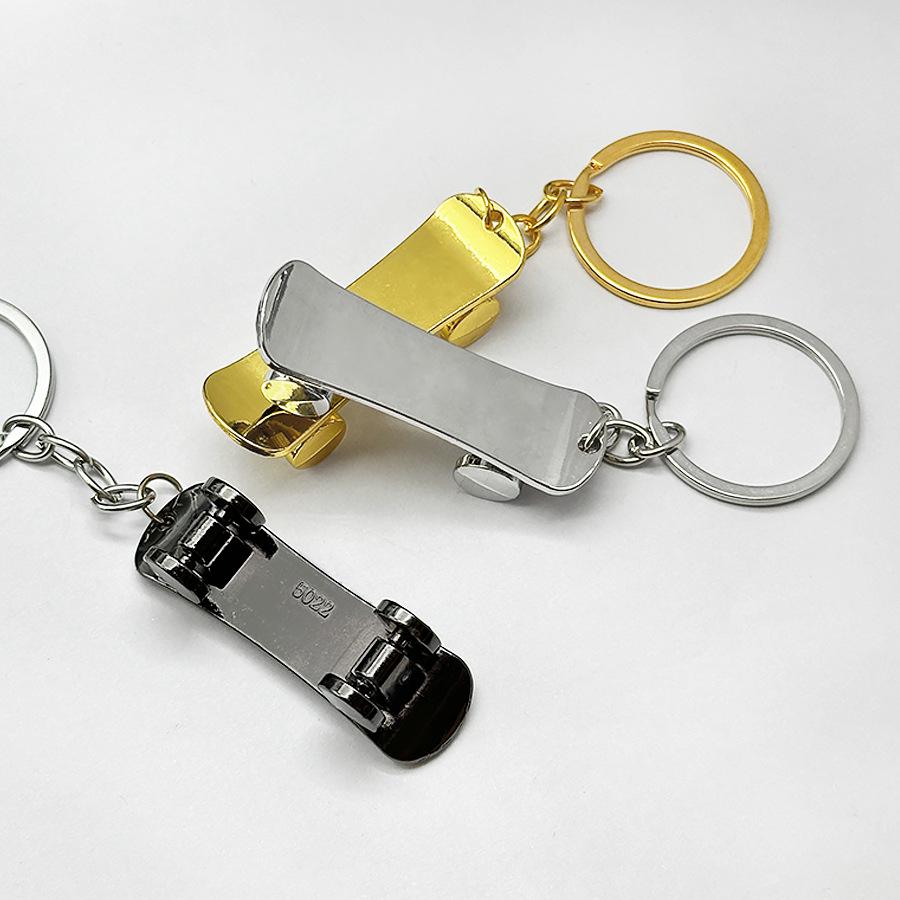 Creative Movable Metal Finger Skateboard Keychain: Rolling Miniature Cart Pendant Ornament
