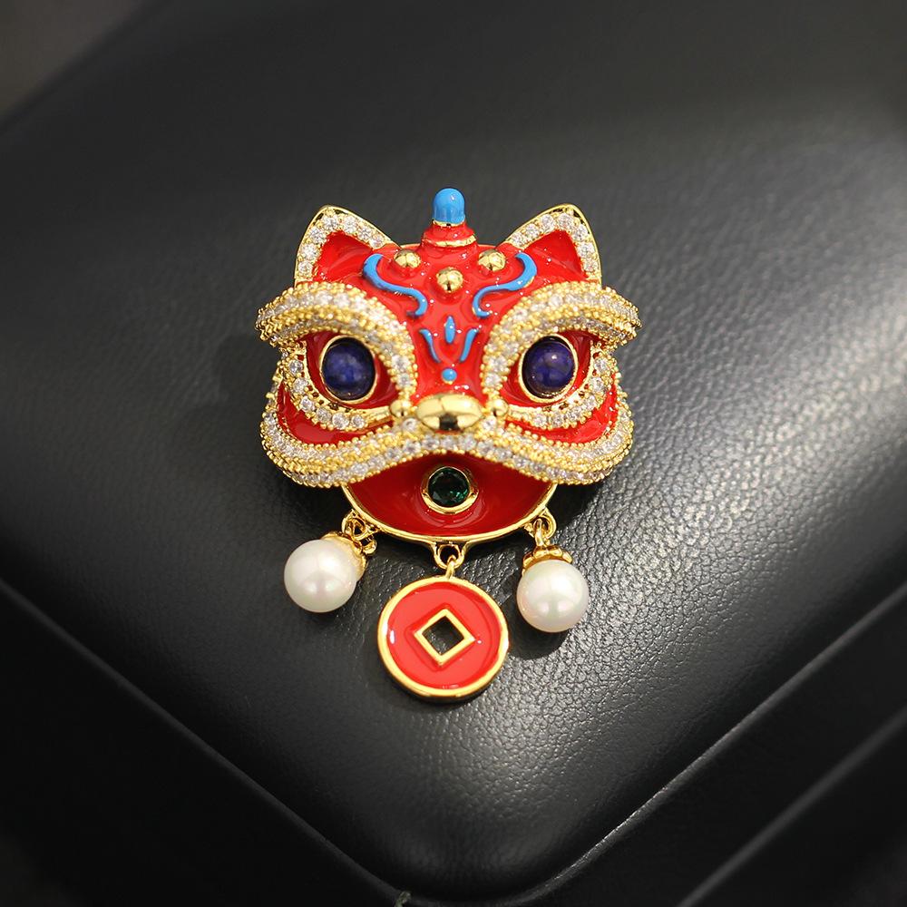 

New Chinese high-end oil dripping red stone lion dancing brooch creative versatile pearl fringed pin accessories men s and women s models