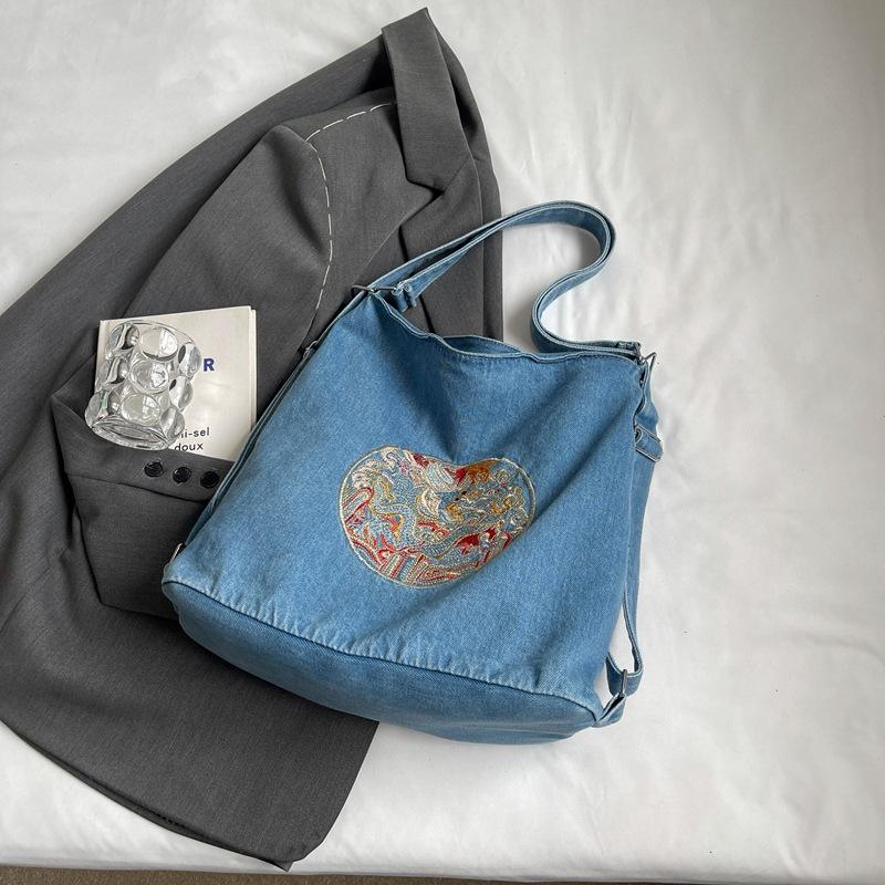 

Ethnic style heavy industry embroidery bucket denim bag 2025 new contrasting color student backpack versatile shoulder bag