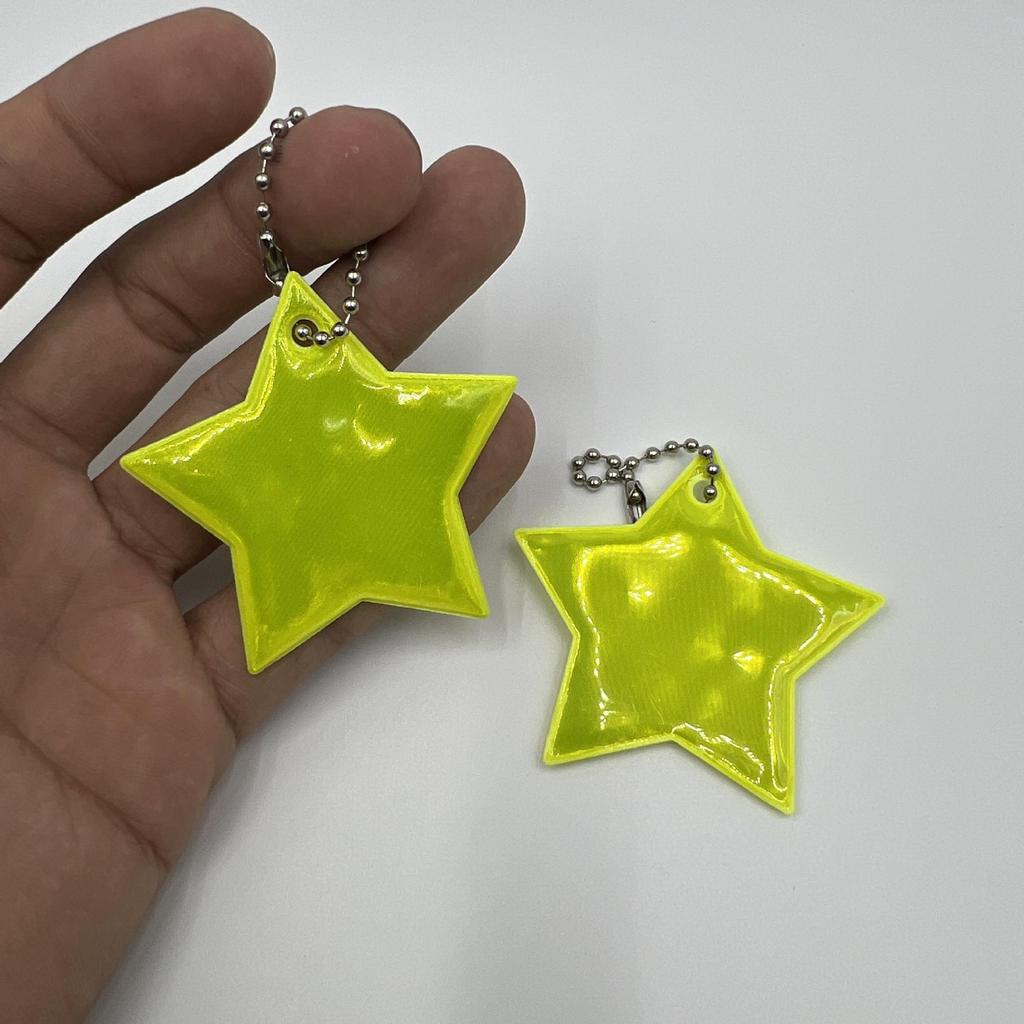 Reflective Star Pendant Keychain for Night Riding: Safety Accessory for Backpack or Luggage.