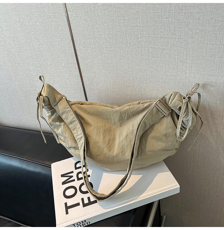 Outdoor sports wind large capacity canvas shoulder messenger bag retro tied knot handbag women's casual new dumpling bag