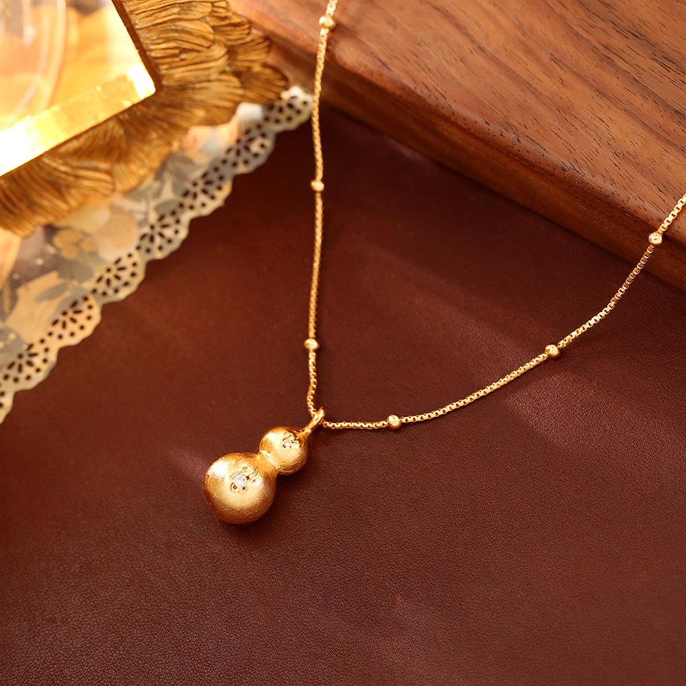 Набор: Ожерелье с подвеской в виде китайской тыквы с цирконами и серьги с позолотой