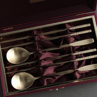 Korean Hunminjeongeum Gold Chopstick and Spoon Set Features Traditional Korean Hangul Script Engraving.