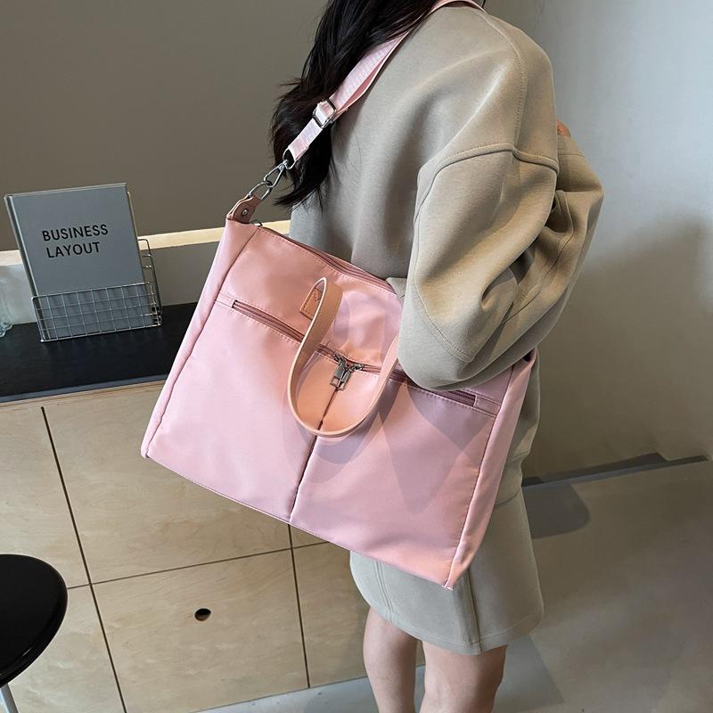 Korean version of simple canvas fashionable large-capacity women's bag 2025 autumn casual foreign style commuter bag shoulder armpit bag