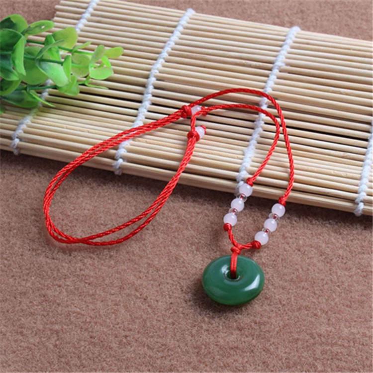 Hetian Jade Guanyin Buddha Pendant Necklace with Red String and Eight Bead Design.