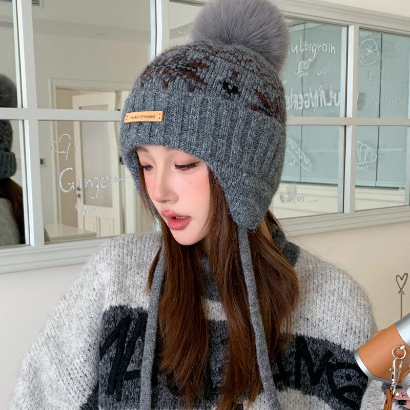 Winter hat women's snowflake jacquard warm knitted hat windproof and cold protection ear protection headgear versatile casual wool hat